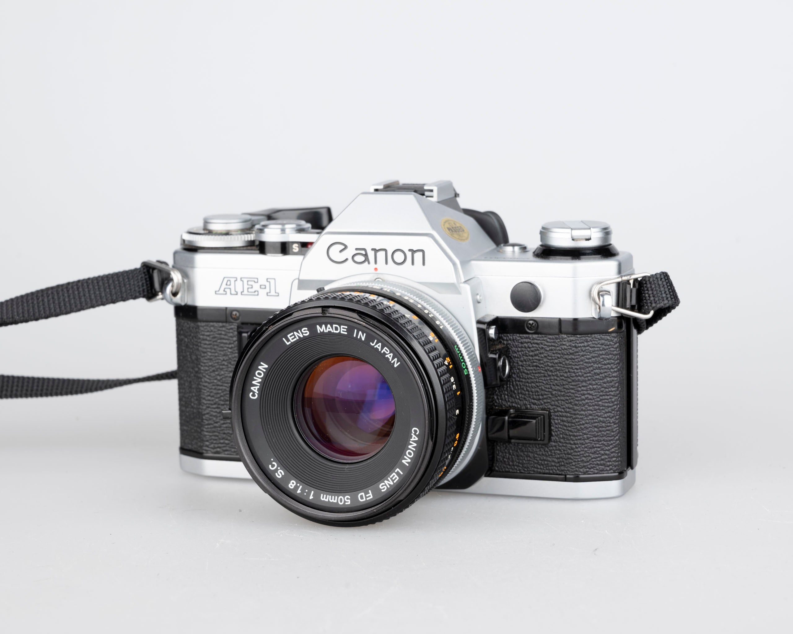 Canon AE-1 35mm SLR w/ Canon FD 50mm f1.8 lens + Speedlite 188A