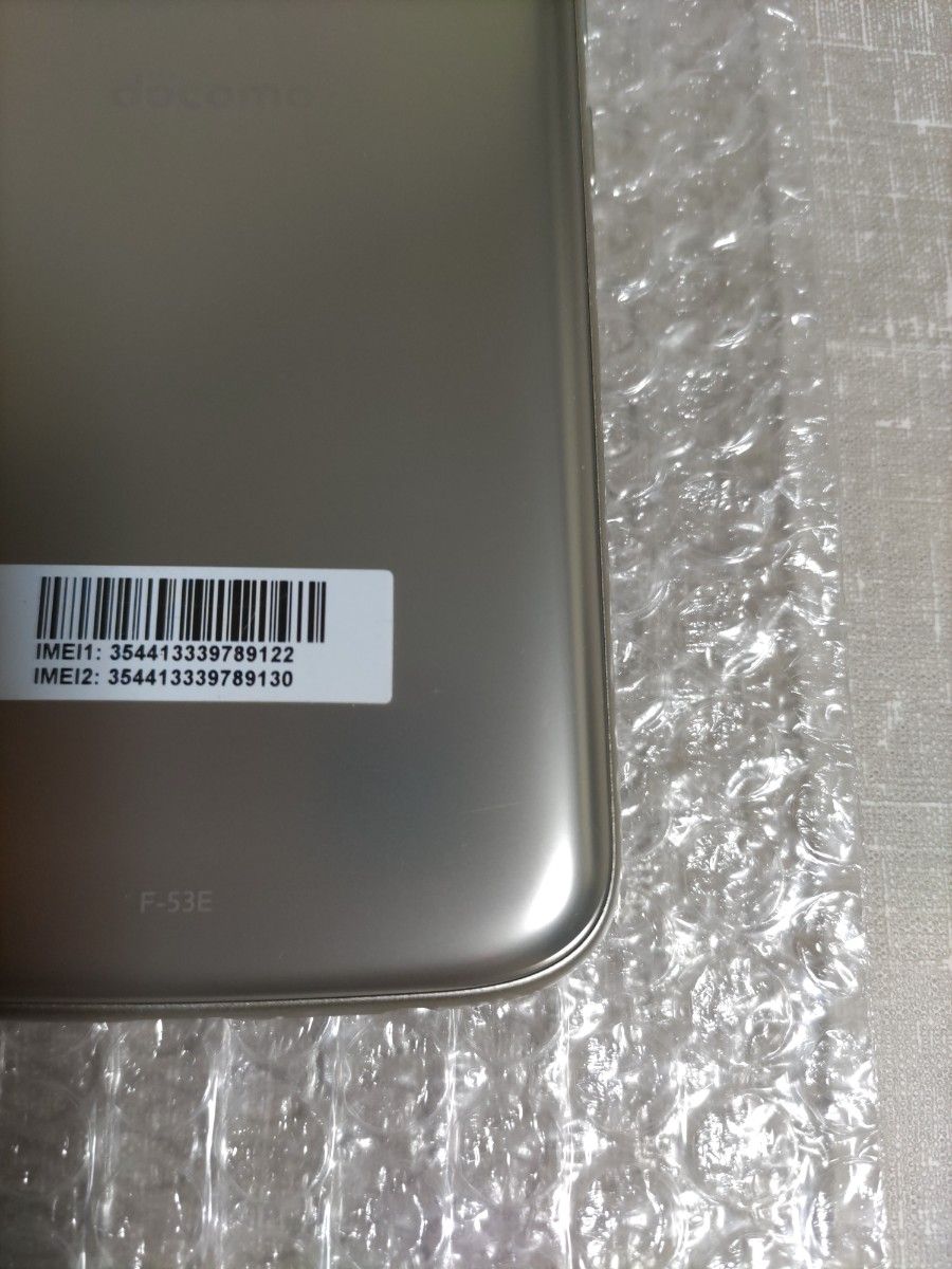 美品 らくらくスマートフォン F-53E ゴールド 新品ケース フィルム付き