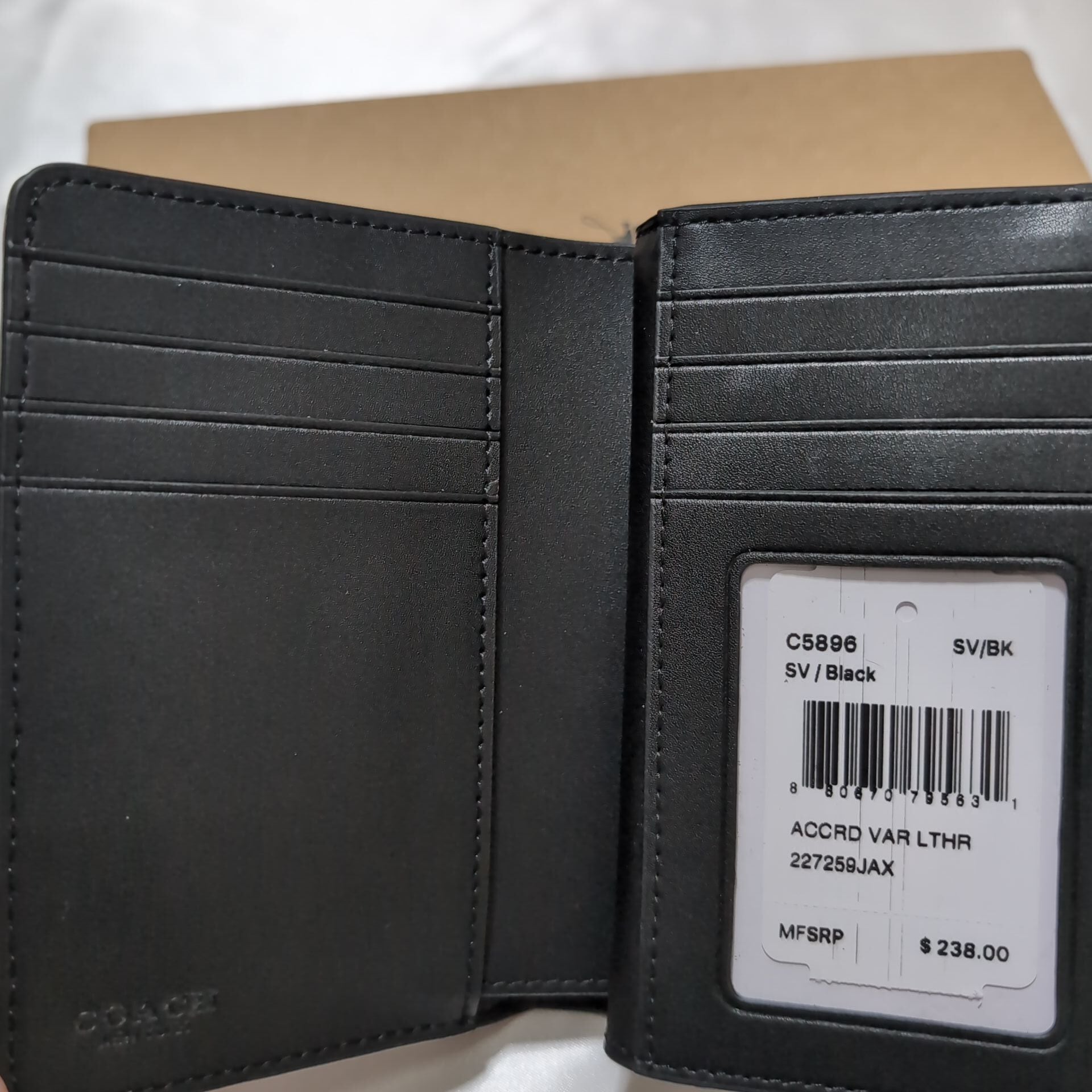 COACHコーチ 二つ折り財布 シグネチャーエンボス ブラック | francore