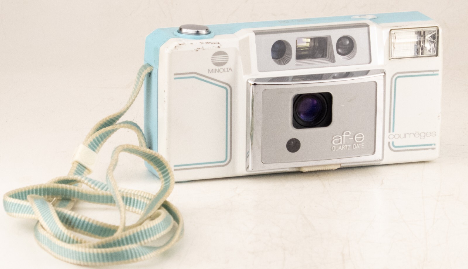 MINOLTA AF-E QUARTZ DATE COURREGES 35mm FILM AF COMPACT CAMERA