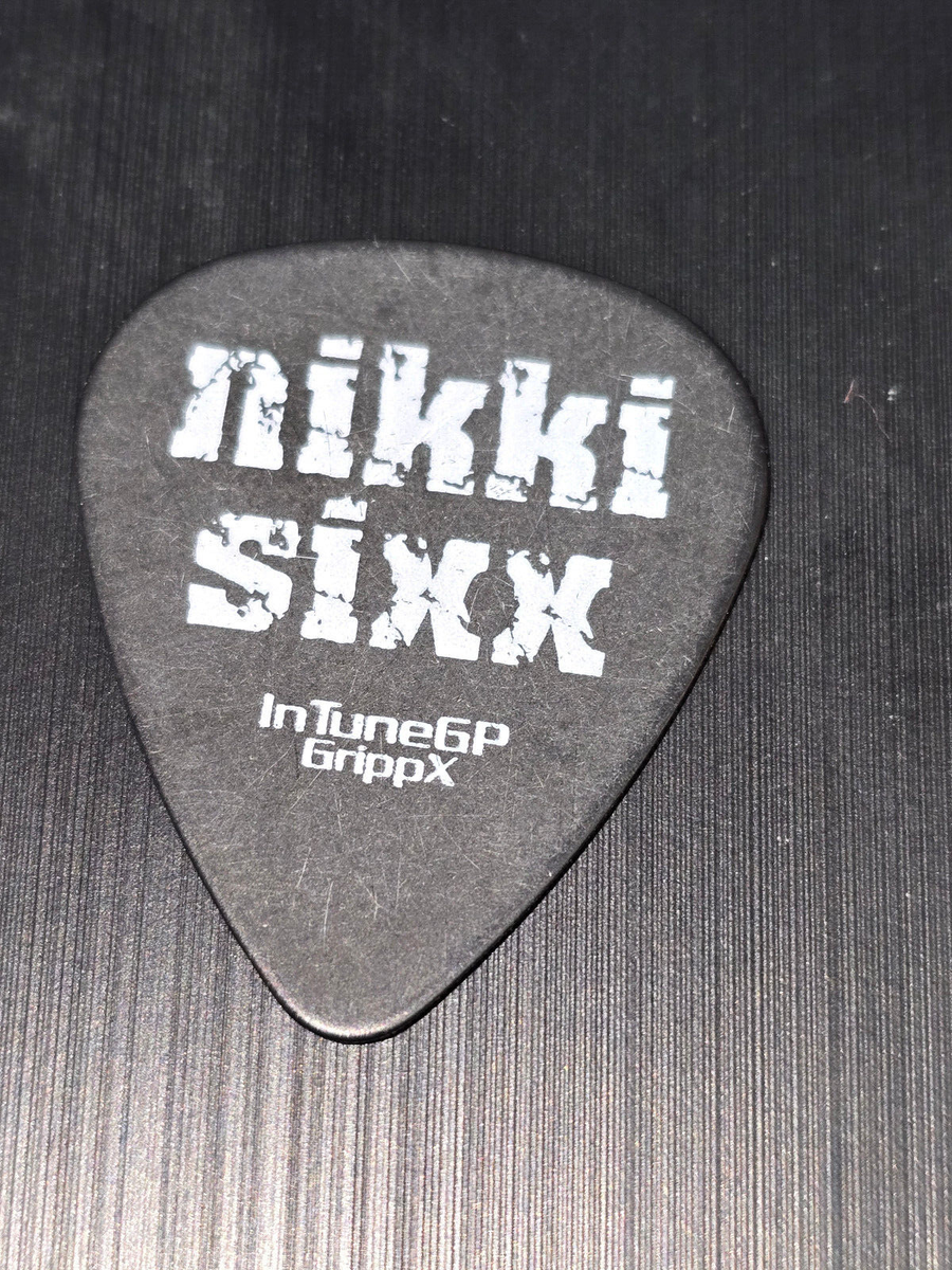 MOTLEY CRUE NIKKI SIXX Fick Dick guitar pick used at a live show