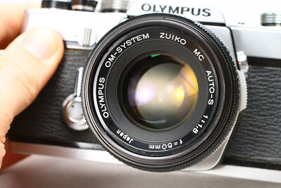 OLYMPUS OM-1 35MM FILM SLR CAMERA W/ ZUIKO 50MM F/1.8 LENS - NO