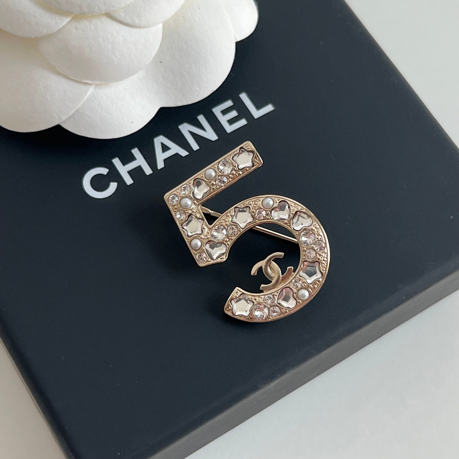 Authentic Chanel Number 5 CC Logo Crystal Brooch 2025 – Luxica