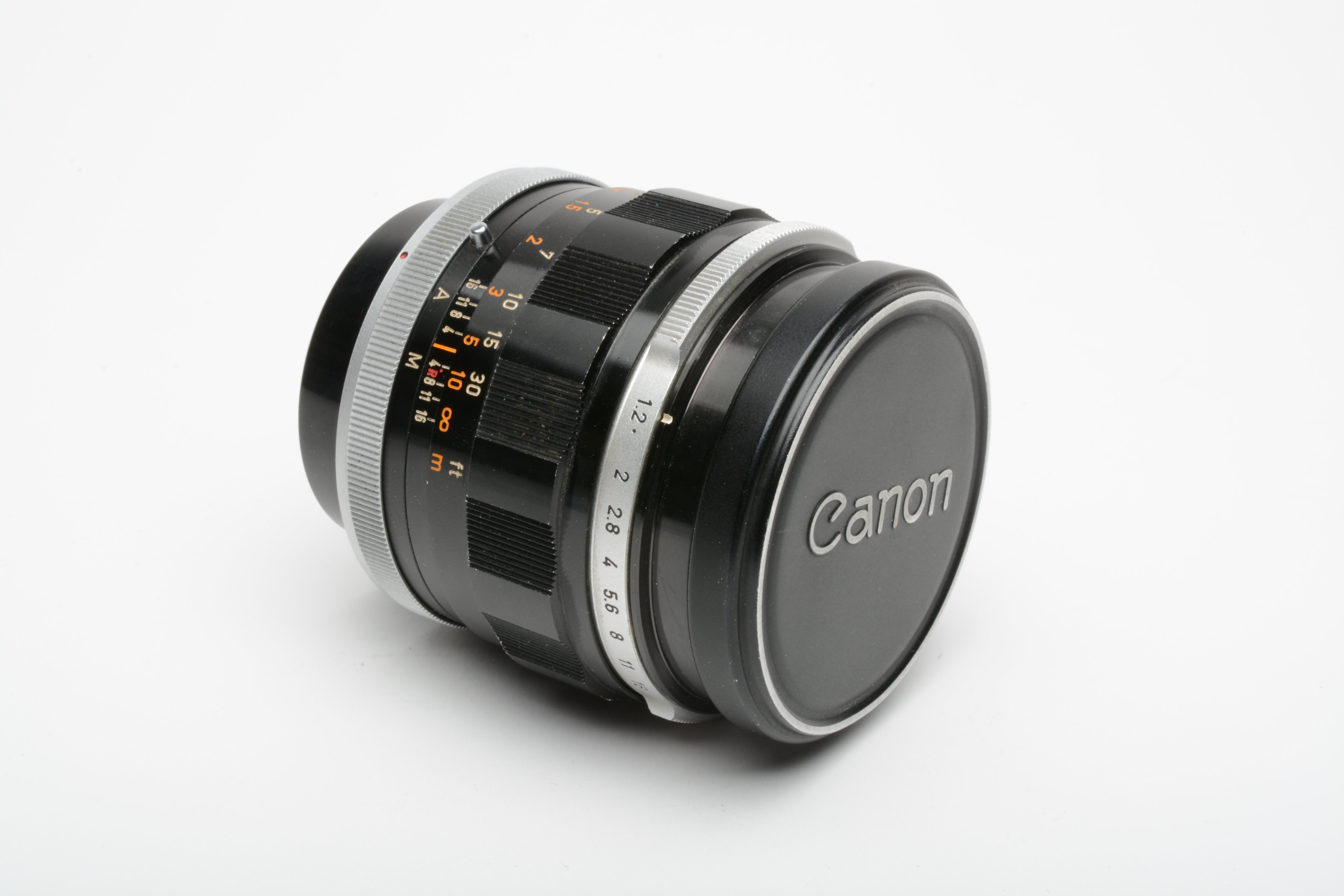 Canon FL 55mm f1.2 prime lens, caps + sky filter, very clean and