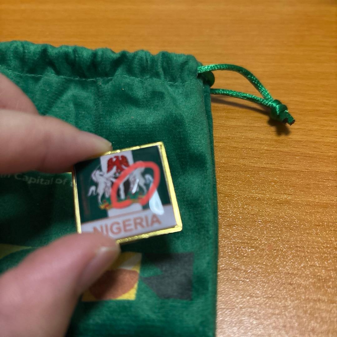 ナイジェリアパビリオンピンバッジ 万博 - メルカリ