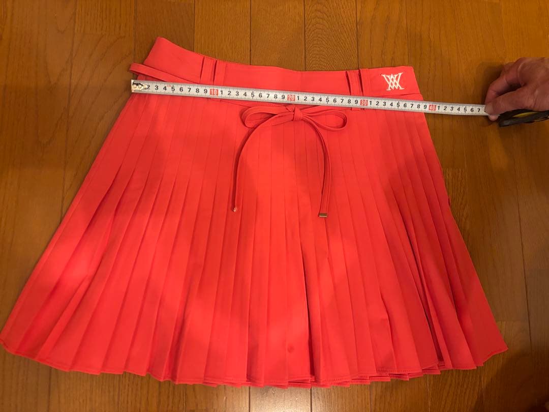 アニユーゴルフ　コーラルピンク プリーツスカート