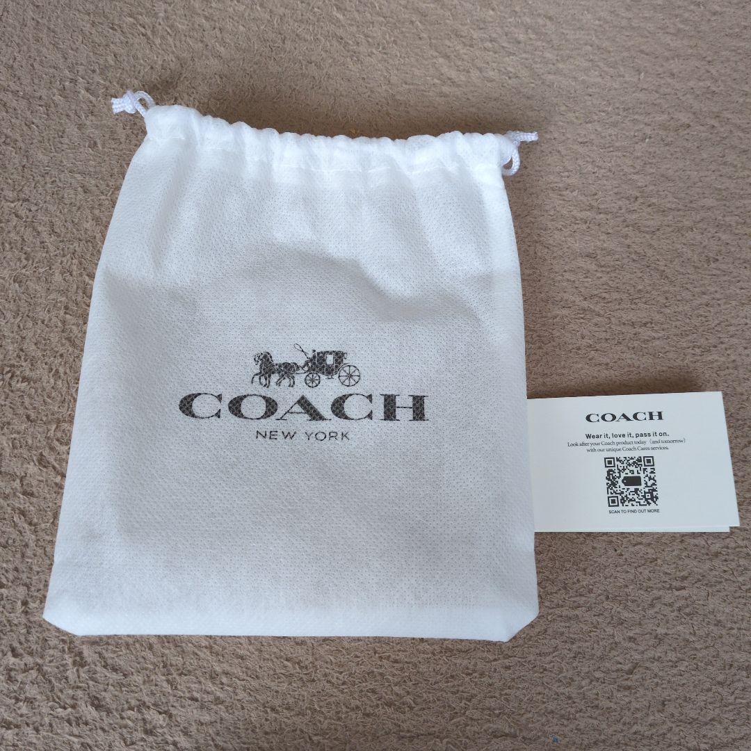 新品未使用COACH 二つ折り財布 デニムブルー ロゴ入り