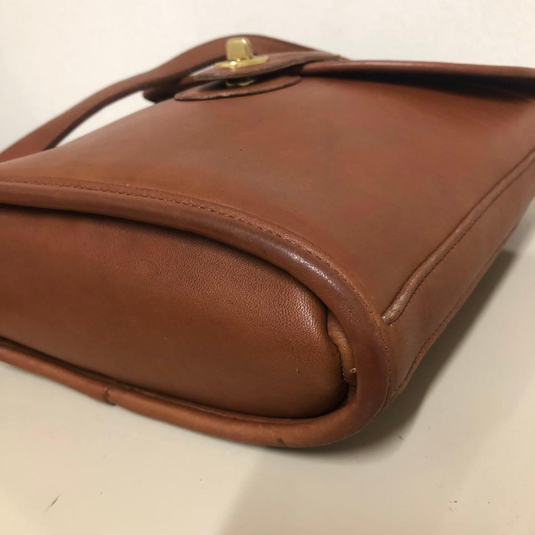 COACH ショルダーバッグ クロスボディ バケツ型 レザー 茶色　ターンロック