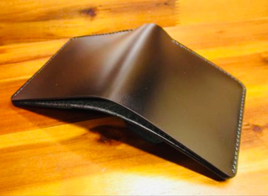 か*ん様 世界に１つ❗️新喜皮革 コードバン ブラック 黒 手縫い 二つ折り 栃