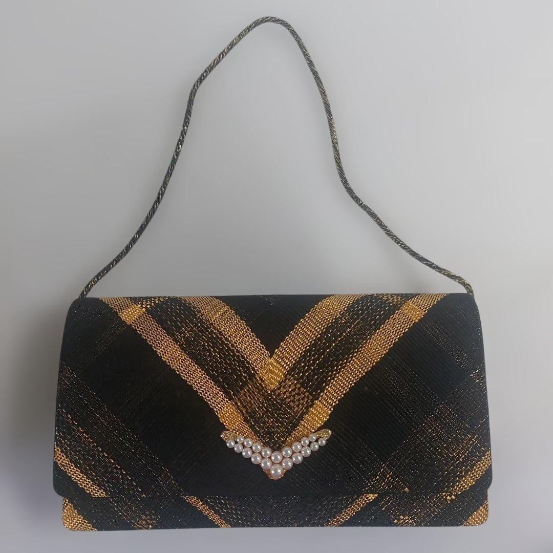 MIKIMOTO 黒と金のチェック柄クラッチバッグ 新品　値段を下げました。
