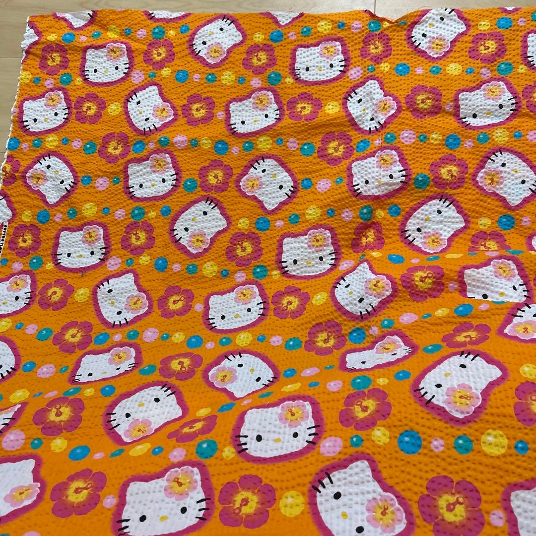 キティ　ちりめん　カオハナ　オレンジ　生地　ハギレ