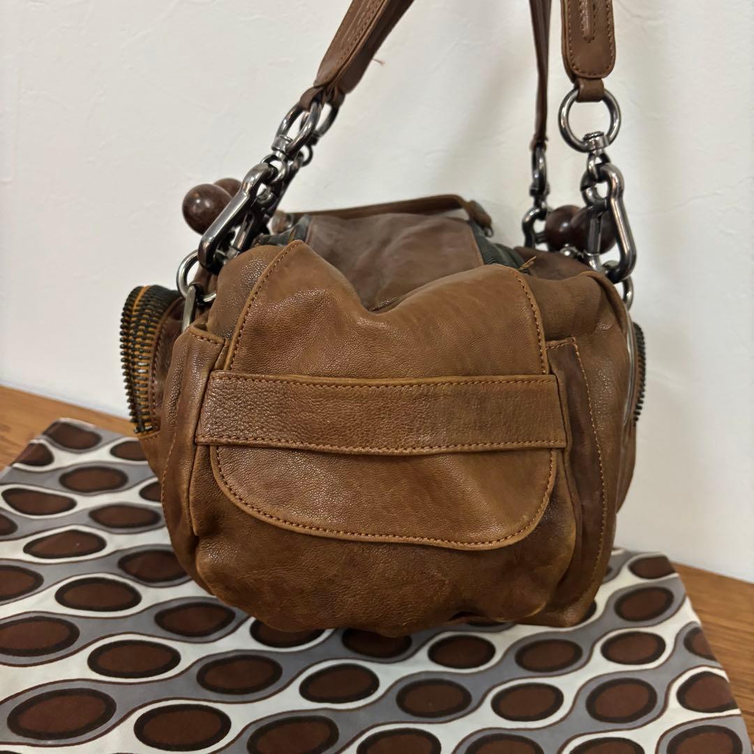 ジャマンピュエッシュ　レザー　ハンドバッグ　木製パーツ　がま口　総柄