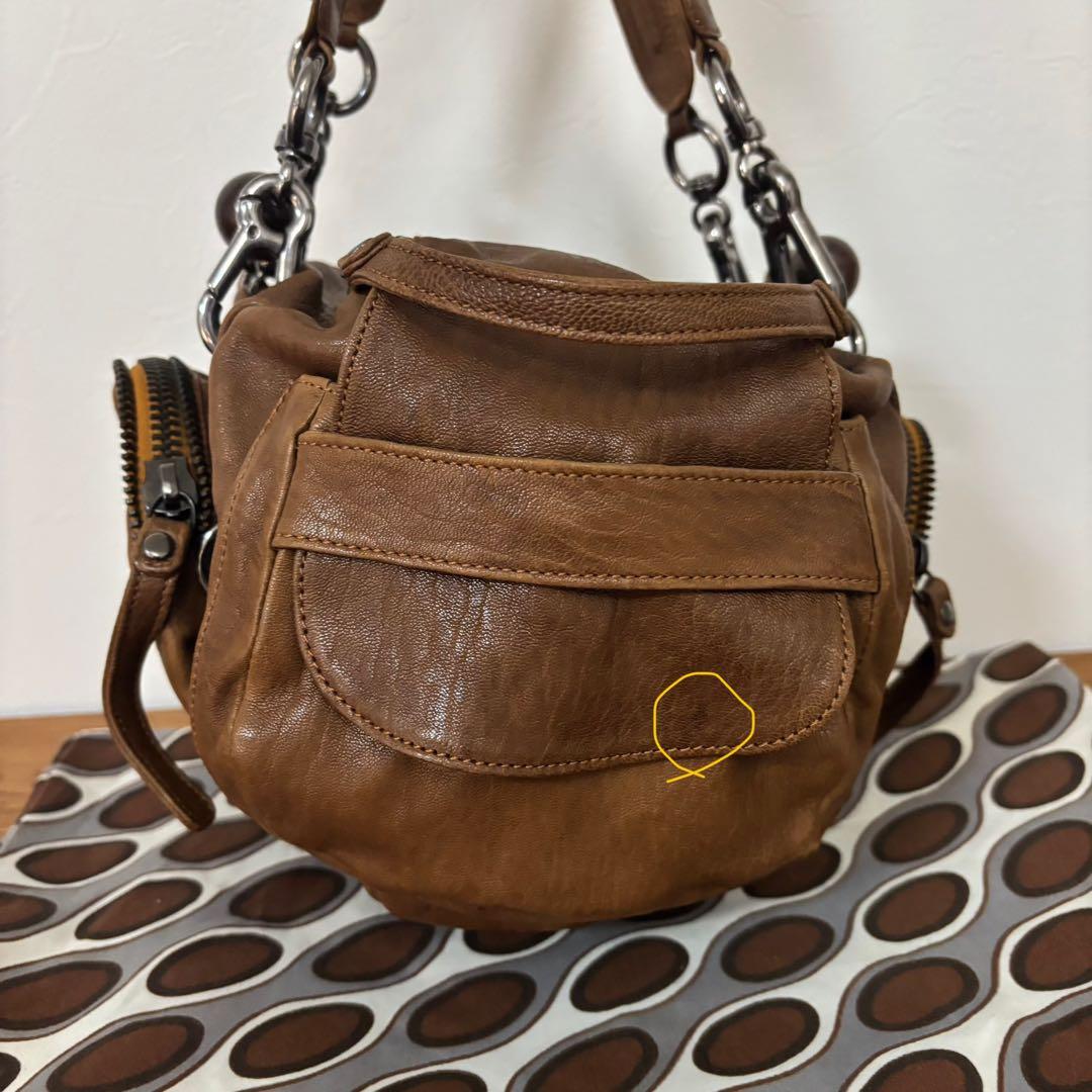 ジャマンピュエッシュ　レザー　ハンドバッグ　木製パーツ　がま口　総柄