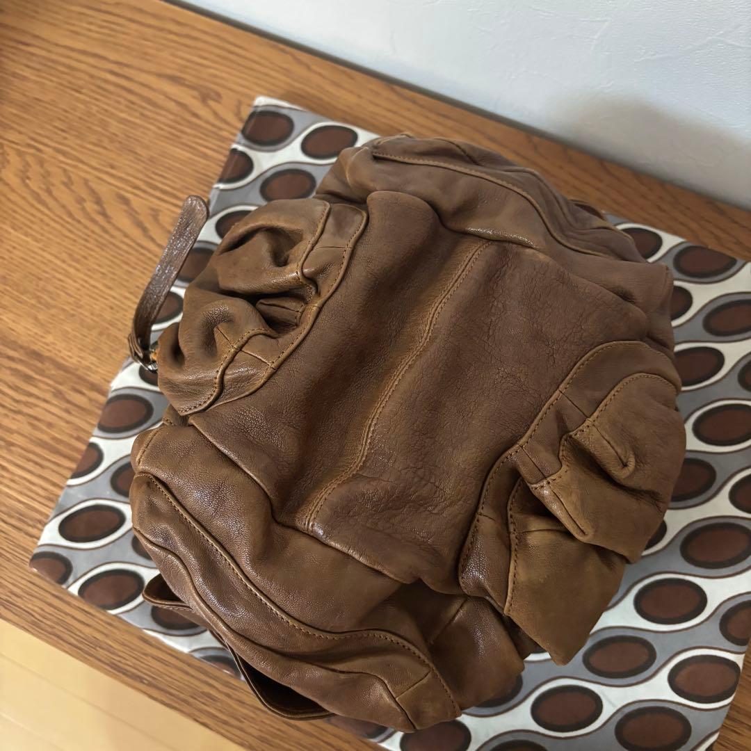 ジャマンピュエッシュ　レザー　ハンドバッグ　木製パーツ　がま口　総柄