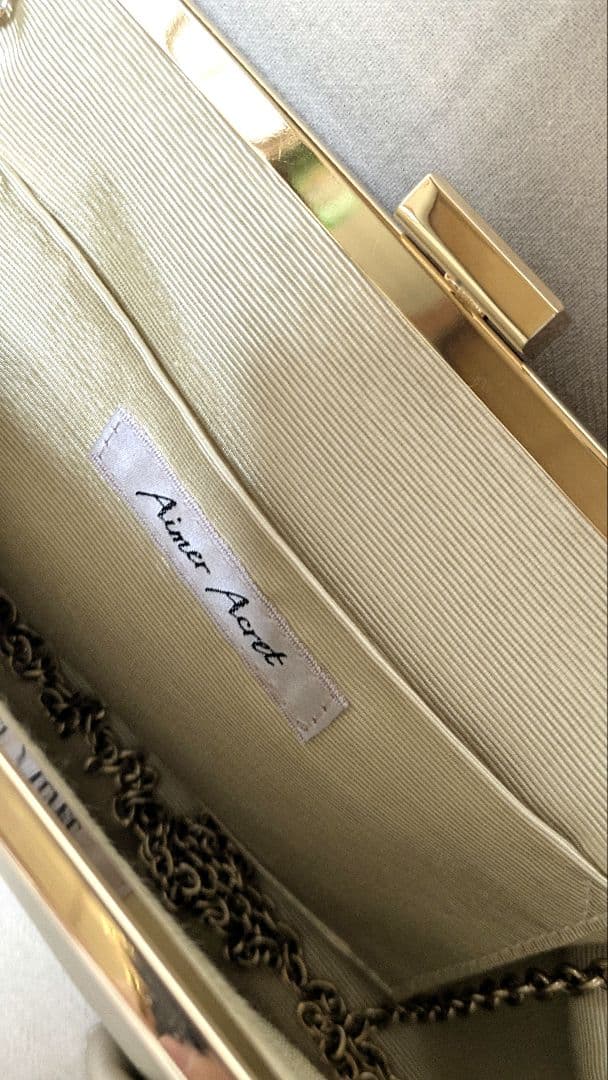 【AIMER（エメ）】ゴールド フレアタッククラッチバッグ