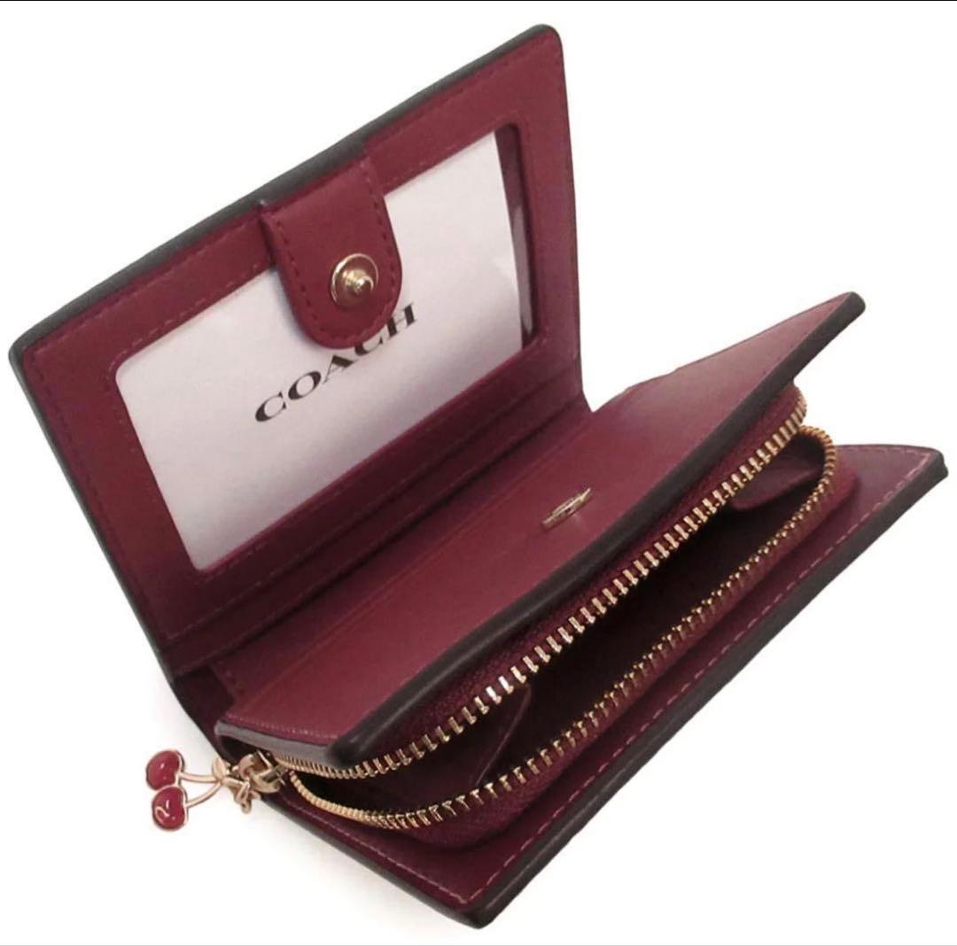 COACH シグネチャーチェリープリント二つ折り財布、さくらん