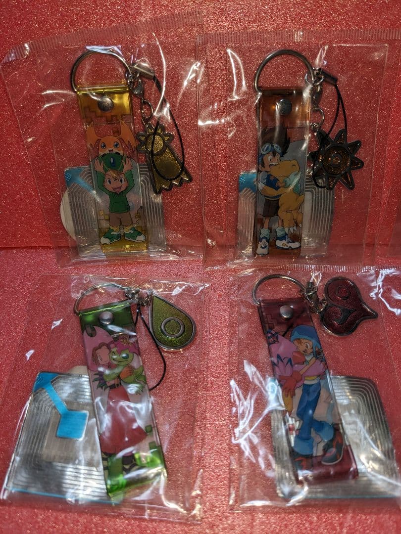 ：【デジモンアドベンチャー】グッズ「トレーディング紋章ストラップ(8個コンプ)」