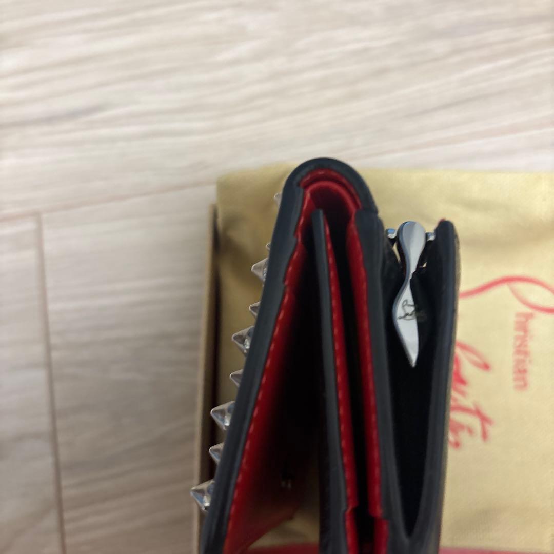 クリスチャン ルブタン スタッズ二つ折り財布 - メルカリ