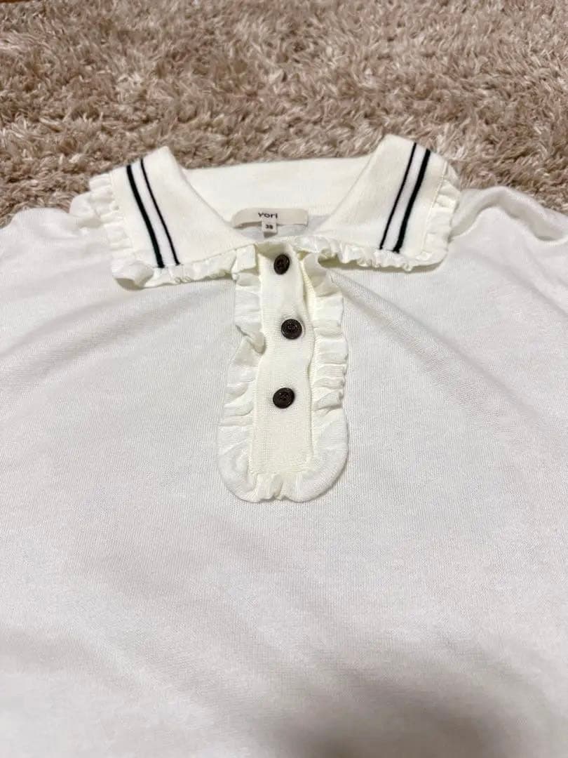 yori ミニフリルポロニット