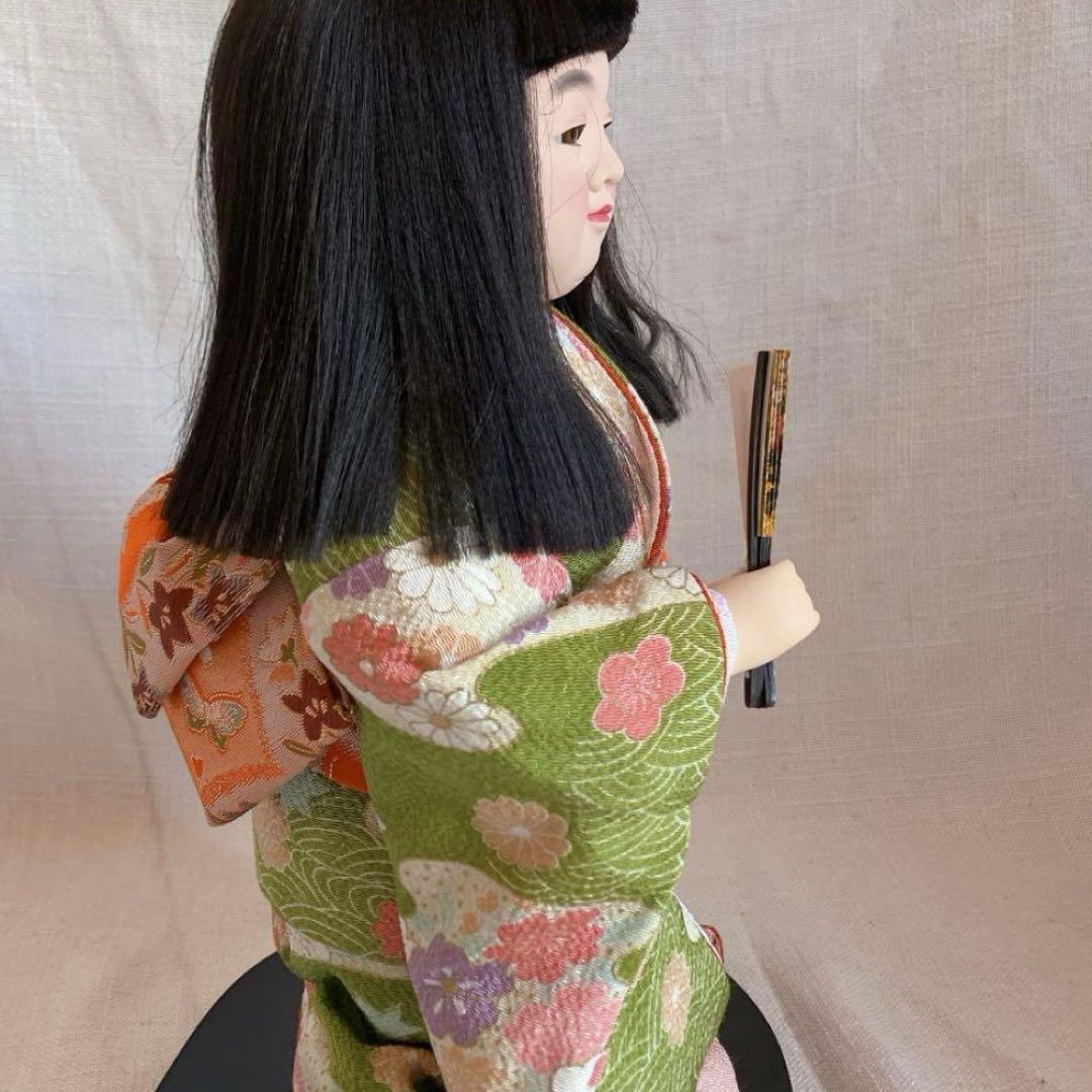 日本人形 赤と黒の着物 尾山人形 伝統的和服 黒赤