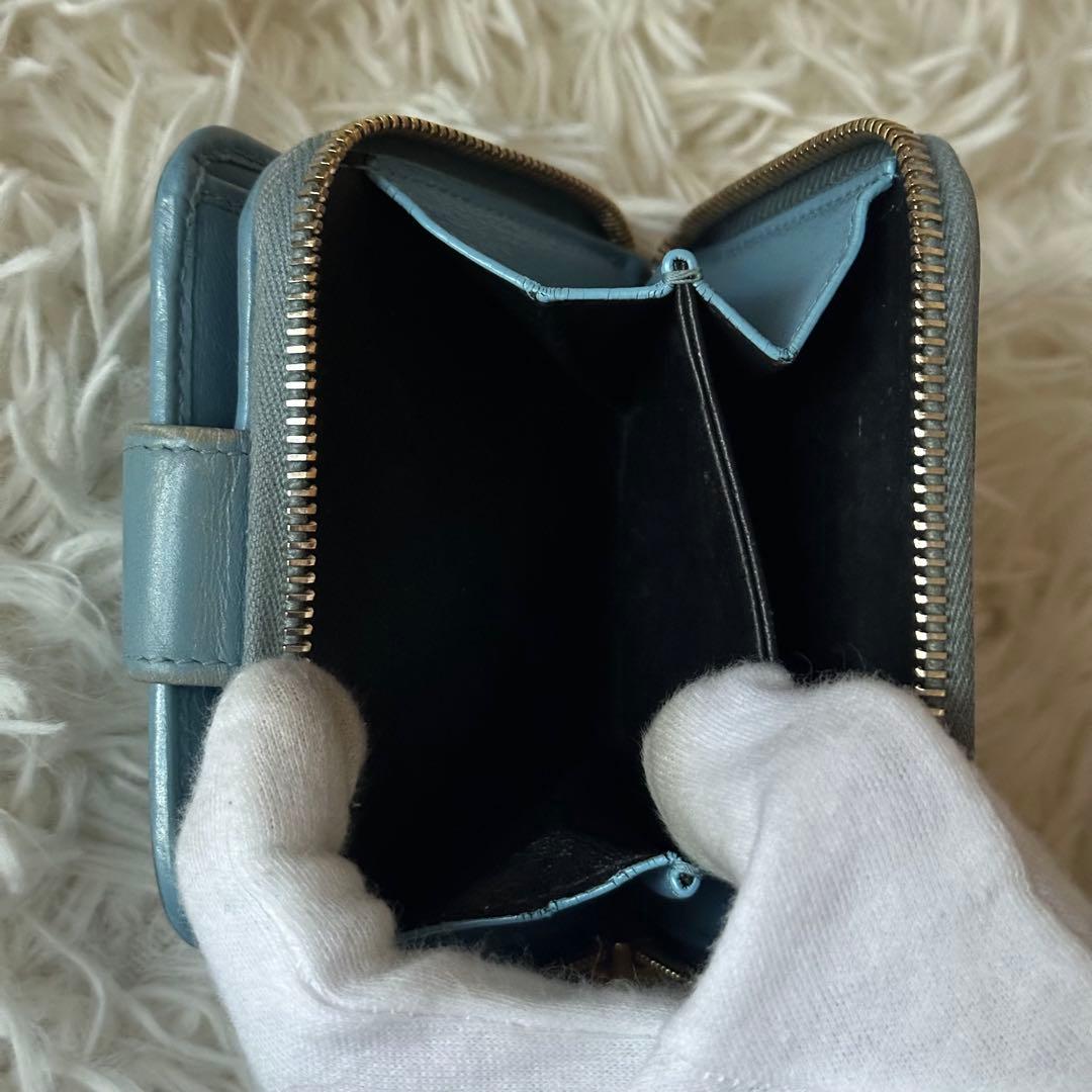 イヴサンローラン 二つ折り財布 型押し レザー ジップ ライトブルー コンパクト