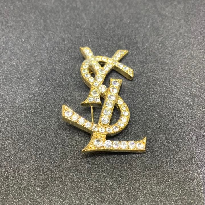 イヴサンローラン ブローチ カサンドラ YSLロゴ ラインストーン