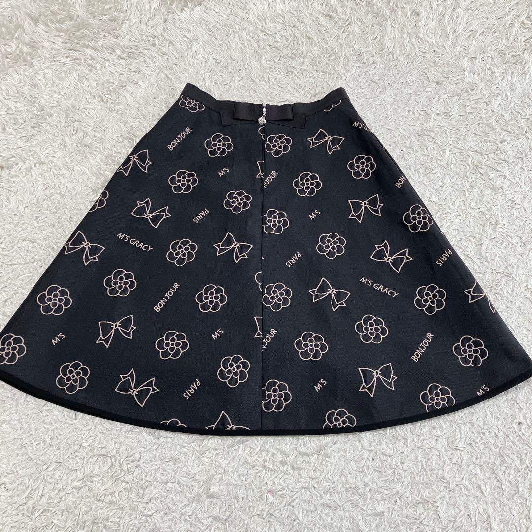 ゆい♪エムズグレイシー　ロゴ　カメリア　チャーム　サーキュラースカート38